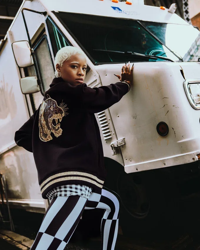 A.I.9 AFRICAN INTELLIGENCE GUILDED LEOPARD – SANDFLOWER COLLAB VARSITY-JACKE