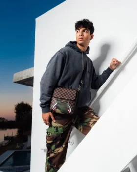MESSENGER-SLING-TASCHE „SHARKS IN PARIS“ MIT GOLDENER REISSVERSCHLUSSTASCHE AUF DER AUSSENSEITE